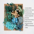 Detail of DIY preserved blue flower kit with dried hydrangeas and strawflowers on kraft board - Flower Pack A8