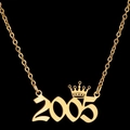 Gold-plated necklace with year 2005 pendant and crown detail on black background - 2005 / Gold