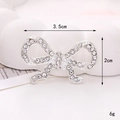Detailed view of silver rhinestone bow charm with 3.5cm x 2cm dimensions and 6g weight - D2475 35mm*20mm Silver Hollow Bowknot