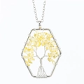 Detail of handmade Tree of Life necklace with yellow crystals in a hexagonal frame - Citrine
