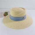 Detail of straw sun hat featuring a light beige weave and blue band with T-shaped logo - M (56-58cm) Adjustable / Beige