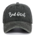 Close-up of Bad Bitch script embroidery on a washed charcoal grey cotton baseball cap - Army Green