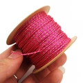 Macro detail of 1mm gold and rose red twisted cord on a cylindrical paper spool - Approx. 1.0mm 40m / Rose Red