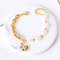 Bracelet doré en acier titane avec perles, lune et breloques œil porte-bonheur - Lune
