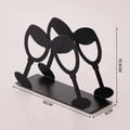 Moderner schwarzer Serviettenhalter aus Metall im kreativen Weinglas-Silhouette-Design - Martini Glas / Schwarz