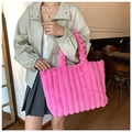 Macro detail of plush bright pink faux fur tote bag showing quilted stripe texture - Rose Red