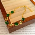 Adjustable gold bracelet with five oval green stones and floral镂空 connections - Golden Emerald Gemstone Flower Bracelet(33#)