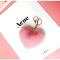 Close-up of a plush pink heart-shaped keychain with gold metal ring and lobster clasp - Pink