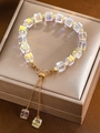 Iridescent crystal square bead bracelet with golden accents and adjustable pull chain - Square Iridescent Crystal Gold Spacer Bracelet (K-624)