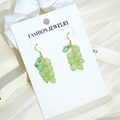 Fresh green grape tassel earrings with gold leaf and translucent beads on silk background - Light Green