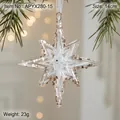 Clear acrylic Christmas star ornament with gold glitter hanging on a festive pine tree branch - 14x14cm/23g / Clear