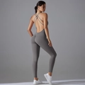 Macro detail of charcoal grey yoga jumpsuit featuring criss-cross back straps and scrunch butt - Titanium Gray