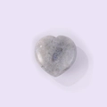 Heart-shaped gray moonstone gemstone with subtle blue flash and natural black spots - White Labradorite