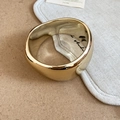 Detailed view of wide chunky gold resin bangle with polished mirror finish and organic curves - Mirror Metal Style