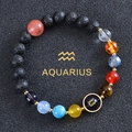 Aquarius zodiac bracelet with blue sandstone and volcanic stones on black texture - Aquarius