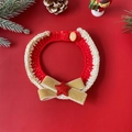 Detail of red and white knitted Christmas pet collar with gold bow and star decoration - Gold Bow Collar