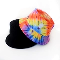 Close-up of dual-style bucket hats featuring solid black and vibrant tie-dye patterns - Rainbow Tie Dye Style