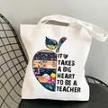 White teacher canvas tote bag featuring an apple floral print with inspirational quote - Style C15