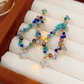 Close-up of vintage gold earrings with colorful beads and crystal charms on beige lining - Silver Earring Post-Blue
