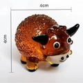 Handcrafted amber glass cow figurine with bubble texture and 4cm dimensions - Yak