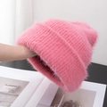 Detail view of pink fuzzy knit beanie showing soft plush texture and thick yarn material - Stretchy / Orange Pink