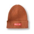 Close-up of caramel ribbed knit beanie featuring a red 'SOLD OUT' patch on the cuff - M (56-58cm) / Caramel color