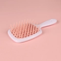 Hollow-out hairbrush in white and pink color contrast for scalp massage and styling - White Handle + Nude Pink