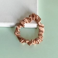 Elegant champagne gold silk satin scrunchie with glossy finish for hair styling - Rose Gold