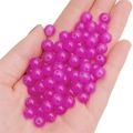 Pink round glass jelly beads for DIY jewelry making held in hand over white background - Rose Red approx 50pcs/pack