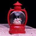 Red lantern snow globe featuring three snowmen on a sled with Merry Christmas base - 2368 Auto-Snow C Snowman