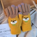 Detail of knitted winter gloves featuring a cute shiba inu dog pattern with touch screen tips - Shiba Inu Yellow