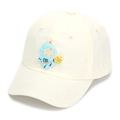 Close-up of cream children baseball cap featuring a blue cartoon astronaut badge - 52-54cm / Off White
