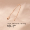 Detailed view of rose gold extension chain with lobster clasp on pink silk texture fabric - Rose Gold Plated 5 Segments