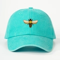 Detail of the stitched honey bee embroidery on mint green cotton baseball cap - One Size / Lake Blue