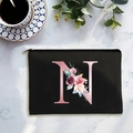 Minimalist black canvas cosmetic bag with floral letter N print and metal zipper closure - Letter N