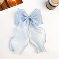 Detail view of light blue organza bow clip with sheer mermaid texture and elegant fabric - Shiny Silk Ribbon Bow / Blue