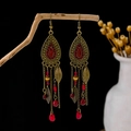 Bohemian vintage gold tassel earrings with red beads and leaf charms hanging on wood - Retro Gold + Red Yellow Beads (E5836-1/Red)