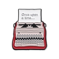 Detail of red vintage typewriter enamel pin with Once upon a time text on white paper - Once Upon A Time Red Style (QHXZ2434)