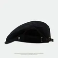 Classic black cotton newsboy cap with vintage metal buckle and side emblem detail - Harajuku Black