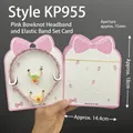Pink bow-themed hair set with pleated headband and floral scrunchies on display card - Kp955 Headband Set Card (approximately 100 Cards)