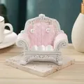 Miniature pink sofa jewelry stand with elegant white pearl drop earrings on stone display - Pink Cloud Pattern