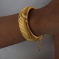 Exaggerated wide gold ribbed cuff bracelet with chain clasp for a statement look - Bracelet-2cm / Gold