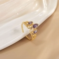 Detail of a gold crown ring with purple teardrop stones on white porcelain - JZ0102B-Gold Dark Red Purple Teardrop Crown