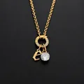 Collier en acier inoxydable avec pendentif lettre E et diamant CZ brillant doré - Lettre E