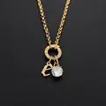 Stainless steel letter E charm necklace with sparkling CZ diamond pendant in gold - Letter E