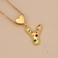 Close-up of golden heart necklace with letter Y pendant and colorful cubic zirconia - Letter Y / Gold