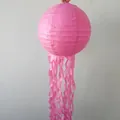 Pink jellyfish-shaped paper lantern with long flowing tassels for party decorations - Pink