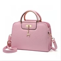 Pink textured leather handbag with gold deer charm and circular handle for women - Pink