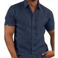 Detail of navy blue short sleeve shirt featuring linen texture and buttoned chest pocket - S / Tops / Navy Blue