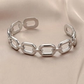 Chunky silver stainless steel chain link open bangle on luxury satin background - Silver